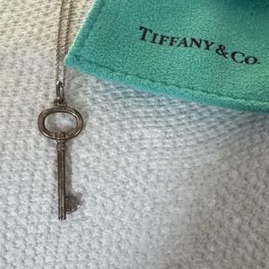 Tiffany & Co. Silver Key Pendant with Teal Pouch